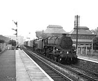 29BKH       Standard 5, 73136 + 45156 ‘Ayrshire Yeomanry’ with the Newcastle Manchester empty stock Newspaper train at Castleton. B K Hilton. 	